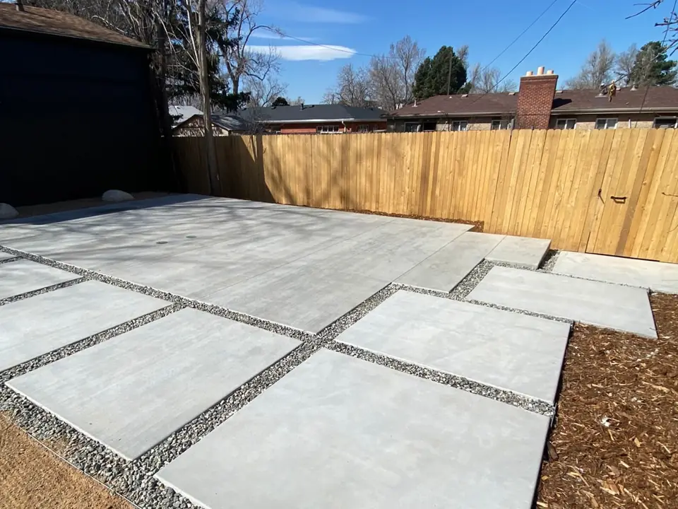 Concrete outdoor paving with decorative gravel joints